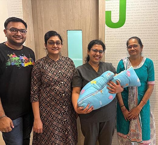 Dr. Anjani Dixit with a family and their newborn on the day of discharge