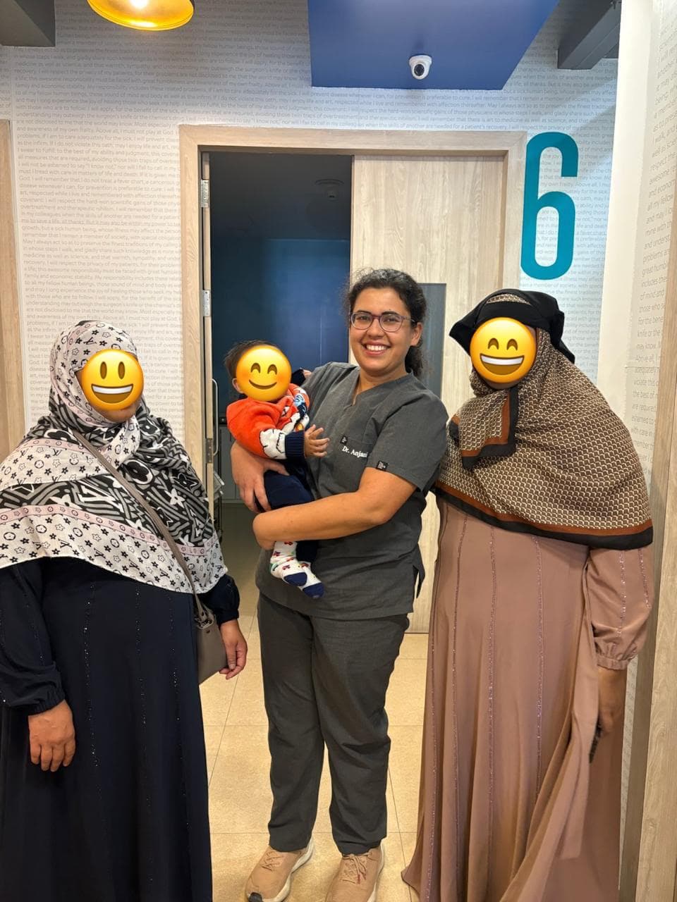 Dr. Anjani Dixit with a family and their baby outside the ward